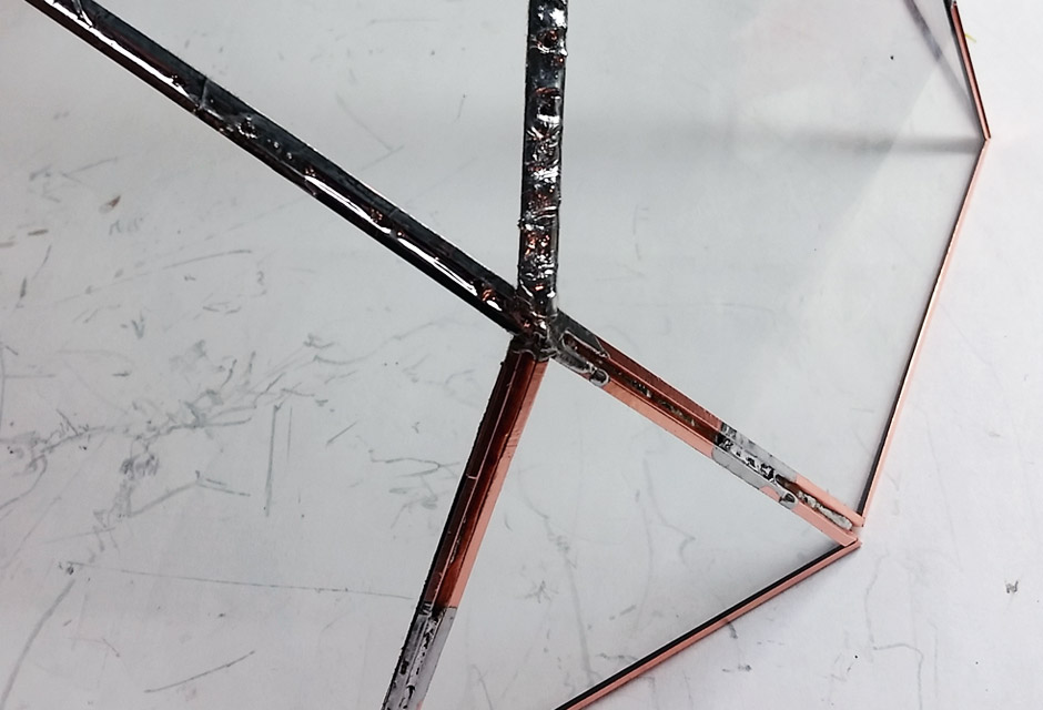tack soldering the copper foil edges of triangles and pentagons together